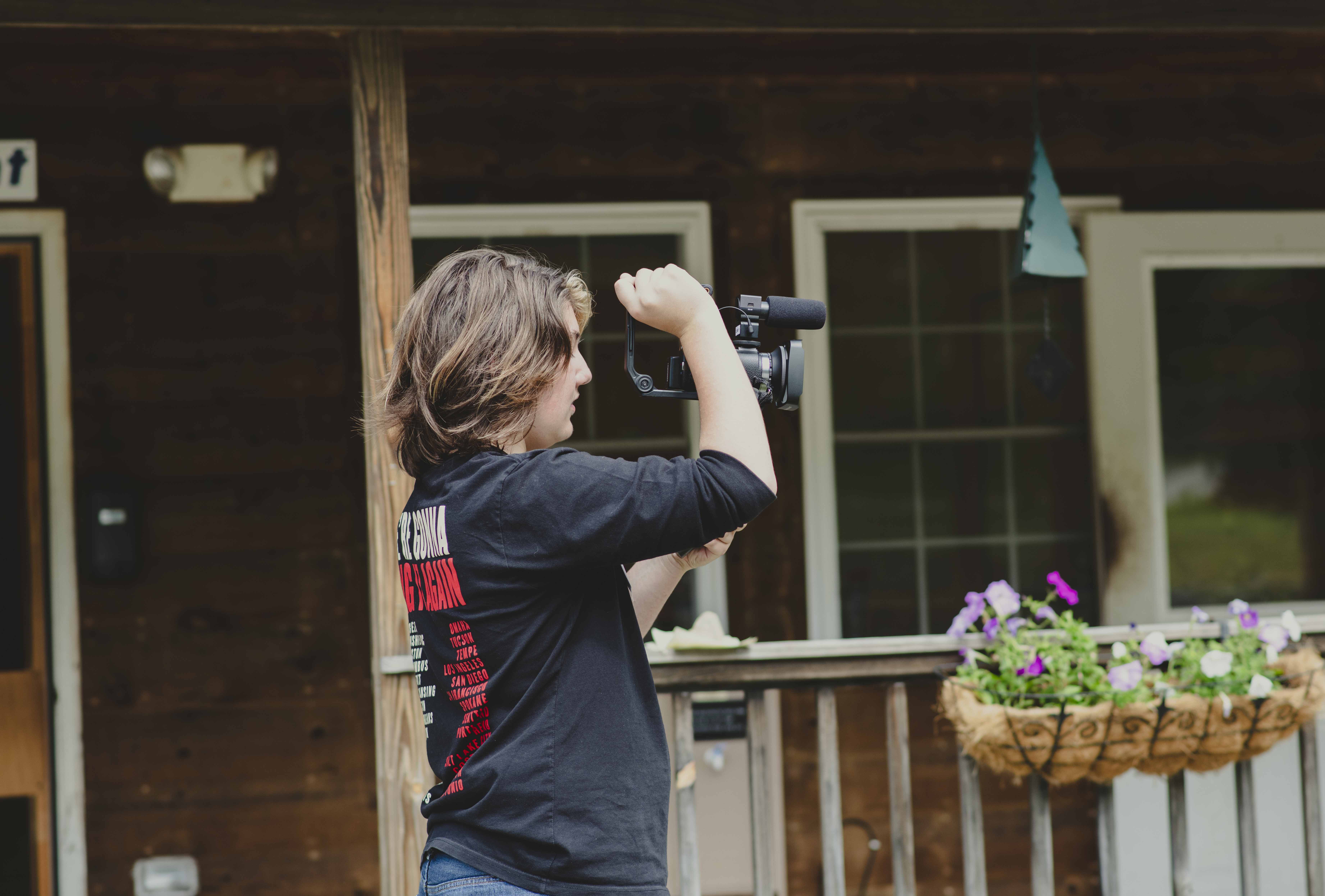 Camper uses a video camera to make a movie